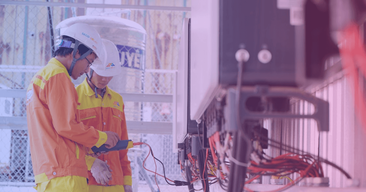 Field engineer reviewing plans on job site