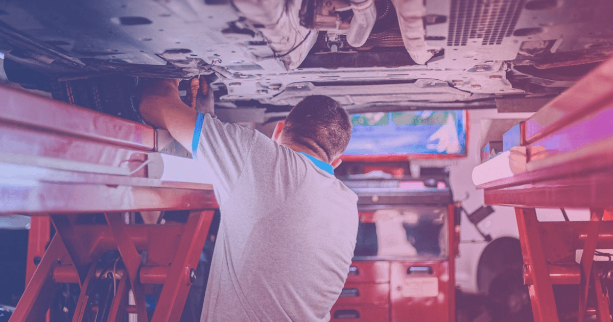 Mechanic working on vehicle engine